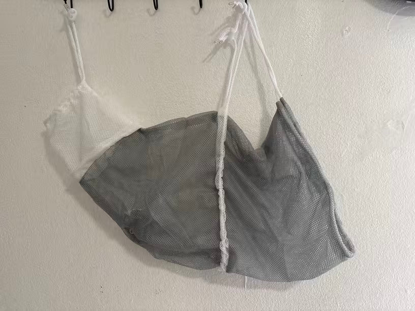 Customer cat wearing the Mewlune bathing bag